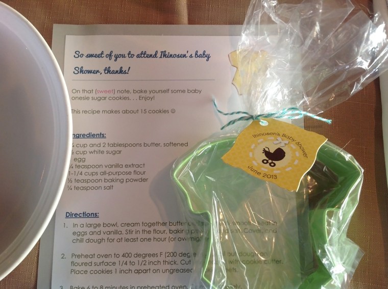 Favors: Onesie shaped cookie cutter along with a recipe card for baking sugar cookies