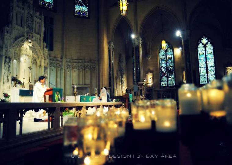 candle lights at church wedding ceremony planned by bay area wedding planner