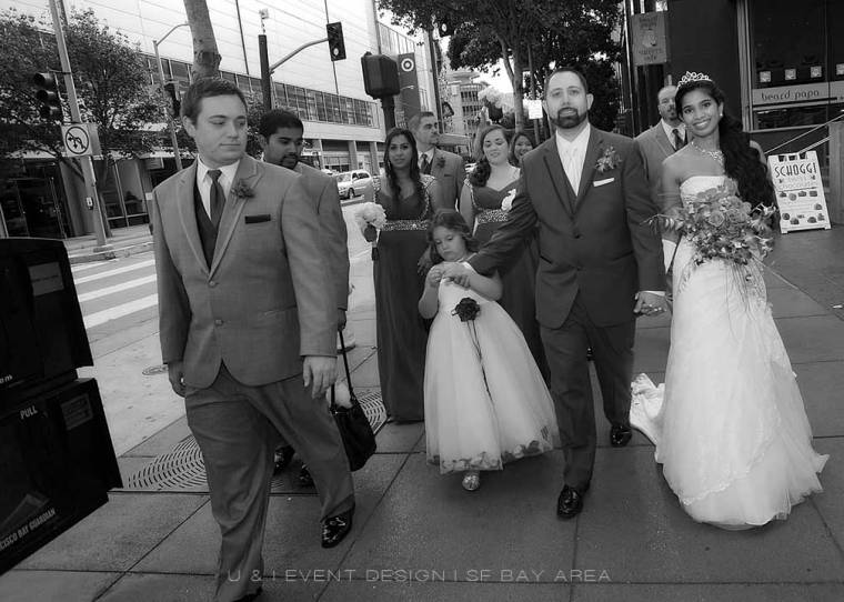 bridal party walking on downtown san francisco street for a wedding planned by bay area planner